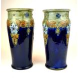 ROYAL DOULTON, A PAIR OF LARGE EARLY 20TH CENTURY STONEWARE BALUSTER VASES Each decorated in