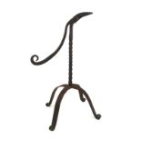 AN 18TH/19TH CENTURY WROUGHT IRON RUSH HOLDER Twist column, four splayed legs. (26.5cm) Condition: