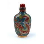 A CHINESE CLOISONNÉ SNUFF BOTTLE Decorated with dragons chasing a flaming pearl, with four character