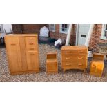 G PLAN, A VINTAGE TEAK FOUR PIECE BEDROOM SUITE Comprising a compactum wardrobe with fitted mirrored