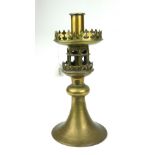 IN THE MANOR PUGIN, A LATE 19TH/EARLY 20TH CENTURY GOTHIC BRASS CANDLESTICK Bearing later