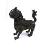 A PERSIAN ISLAMIC LION BRONZE CENSOR Having a hinged head and pierced scrolling to body. (approx