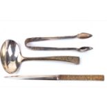 STUART DEVLIN, THREE SILVER GILT CUTLERY ITEMS Sauce ladle, paper knife and a pair of sugar tongs,