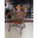 A 19TH CENTURY ASH AND ELM COMB BACK ARMCHAIR. (58cm x 47cm x 86cm) Condition: good, in accordance