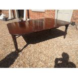 IN THE MANNER OF GILLOW, A 19TH CENTURY MAHOGANY TELESCOPIC EXTENDING DINING TABLE With two extra
