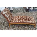 A GIRAFFE SKIN UPHOLSTERED DAYBED On a honey oak base, supported on square splayed legs. (142cm x