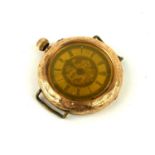 AN EARLY 20TH CENTURY 14CT GOLD WRISTWATCH Having an engraved outer case, dial and manual wind. (