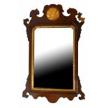 A GEORGIAN MAHOGANY AND PARCEL GILT MIRROR. (37cm x 60cm) Condition: good