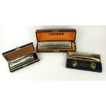 A COLLECTION OF THREE VINTAGE HOHNER HARMONICA MUSICAL INSTRUMENTS To include a 64 Chromatica, a