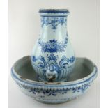 A LATE 18TH/EARLY 19TH CENTURY FRENCH FAIENCE POTTERY WALL MOUNTED OVOID FORM WATER CISTERN AND SINK
