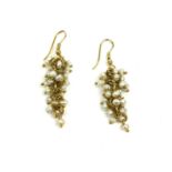 A VINTAGE PAIR OF YELLOW METAL AND SEED PEARL CHANDELIER EARRINGS The arrangement of seed pearls