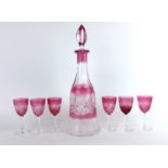 A VINTAGE BOHEMIAN GLASS LIQUOR SET To include a decanter with cranberry glass overlay and six