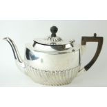 A VICTORIAN SILVER TEAPOT Having ebonised wood finial and handle and half flutes to body, with