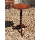 A VICTORIAN OAK OCCASIONAL TABLE The circular top raised on barley twist column with three splayed