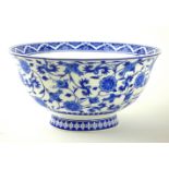 A CHINESE BLUE AND WHITE PORCELAIN BOWL Decorated with entwined floral sprays, bearing a square