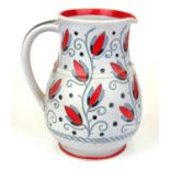 CHARLOTTE RHEAD, A BURSLEY WARE JUG In rare tubelined floral designs. (18.5cm) Condition: good