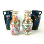 A PAIR OF 19TH CENTURY CHINESE FAMILLE ROSE VASES Having raised dragons and hand painted figural
