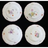 A SET OF FOUR 18TH CENTURY GERMAN LUDWIGSBURG PORCELAIN PLATES Hand painted with floral decoration