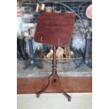 A REGENCY PERIOD MAHOGANY AND EBONY INLAID ADJUSTABLE MUSIC STAND On a ring turned column with three