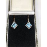 A PAIR OF 9CT GOLD, BLUE TOPAZ AND DIAMOND EARRINGS.