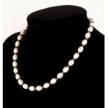 AN 18CT GOLD, PEARL AND AMETHYST NECKLACE The oval mother of pearl pearl beads interspersed with