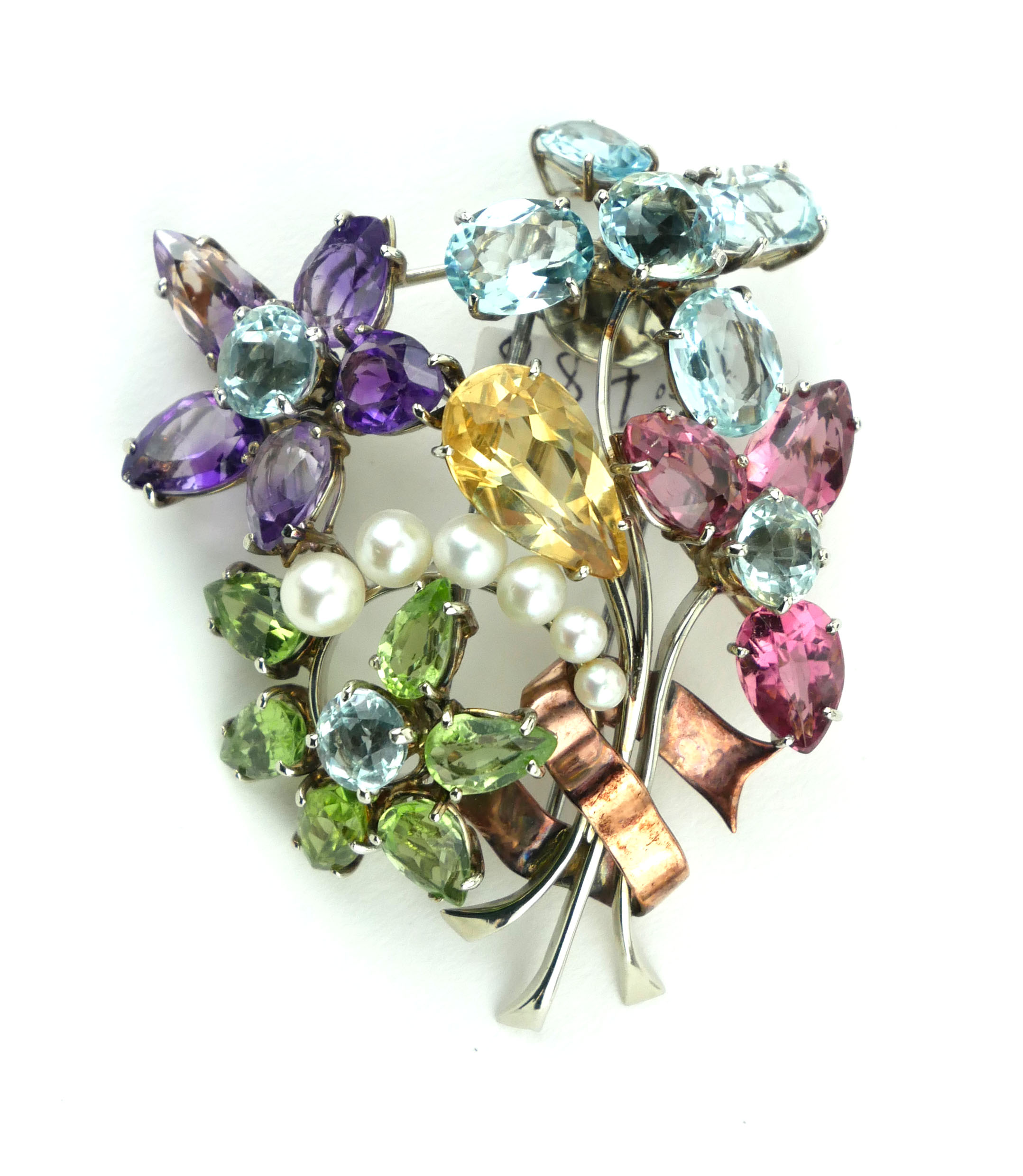 A WHITE AND ROSE GOLD, PEARL, AQUAMARINE, PERIDOT, AMETHYST AND CITRINE SPRAY BROOCH, CIRCA 1950.