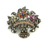 A SILVER, ROSE CUT DIAMOND, MARCASITE, PERIDOT, CITRINE AND GARNET BASKET BROOCH.