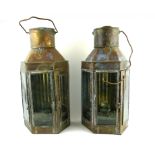 A PAIR OF 19TH CENTURY BRASS LANTERNS Having carry handles, glass panels and oil burners, marked '
