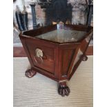 A REGENCY PERIOD MAHOGANY WINE COOLER The zinc lined tapering body fitted with lion mask loop