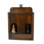 A RARE 19TH CENTURY OAK WEATHER VANE BOX With hand automation figures. (18cm x 25cm x 13cm)