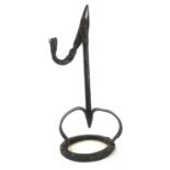 A SUBSTANTIAL ANTIQUE WROUGHT IRON RUSHLIGHT Square column, two splayed legs, on circular base. (