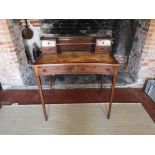 A 19TH CENTURY MAHOGANY AND LINE INLAID LADIES' WRITING TABLE Having an arrangement of drawers,