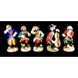 A SET OF FIVE 20TH CENTURY GERMAN PORCELAIN MONKEY BAND FIGURES A conductor and four musicians