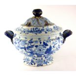 A LARGE 19TH CENTURY BLUE AND WHITE POTTERY TUREEN AND COVER Having twin handles and underglaze blue