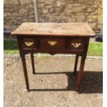 A GEORGIAN MAHOGANY LOWBOY With three drawers, raised on turned legs on pad feet. (76cm x 44cm x