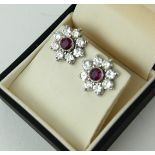 A PAIR OF 18CT WHITE GOLD, RUBY AND DIAMOND CLUSTER EARRINGS. (ruby approx 1.01ct, diamond approx