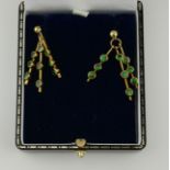 A PAIR OF 9CT GOLD AND TSAVORITE GREEN GARNET EARRINGS.