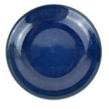 A CHINESE BLUE GLAZE PORCELAIN SHALLOW DISH Plain form, bearing a six character mark to base. (