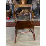 A 19TH CENTURY ELM AND FRUITWOOD COUNTRY OPEN ARMCHAIR With pierced central rail, on turned legs. (