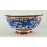 A CHINESE PORCELAIN BOWL Decorated with an opposing dragon, bearing a six character mark to base. (