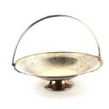 A VICTORIAN SILVER SPHERICAL CAKE BASKET With swing handle, beaded edge and engraved floral
