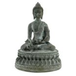 A BRONZE BUDDHA Seated pose, with green patination. (33cm) Condition: good