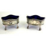 A PAIR OF GEORGIAN SILVER AND BLUE GLASS SALTS Classical form with serpentine beaded edge,