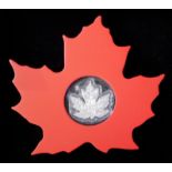 TWO CANADIAN SILVER MAPLE LEAF $20 COINS In red plastic mounts and protective capsules, together