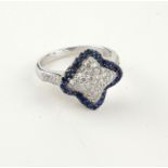 AN 18CT WHITE GOLD, SAPPHIRE AND PAVÉ SET DIAMOND RING (size N¾).