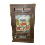 AN EARLY 20TH CENTURY OAK 'ALL WIN' PENNY ARCADE SLOT MACHINE Rectangular form, with penny slot