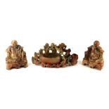 A PAIR OF CHINESE SOAPSTONE BOOKENDS, seated Buddhas along with a brush holder (12.5cm) Condition:
