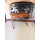 A REGENCY PERIOD MAHOGANY AND EBONY INLAID SOFA TABLE With two real and two false drawers, raised on