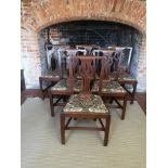 A SET OF SIX 19TH CENTURY OAK DINING CHAIRS With pierced vase splat backs, floral needlework