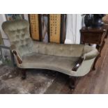 A VICTORIAN MAHOGANY FRAMED TWO SEAT WINDOW CHAISE LOUNGE Button back green velvet upholstery. (